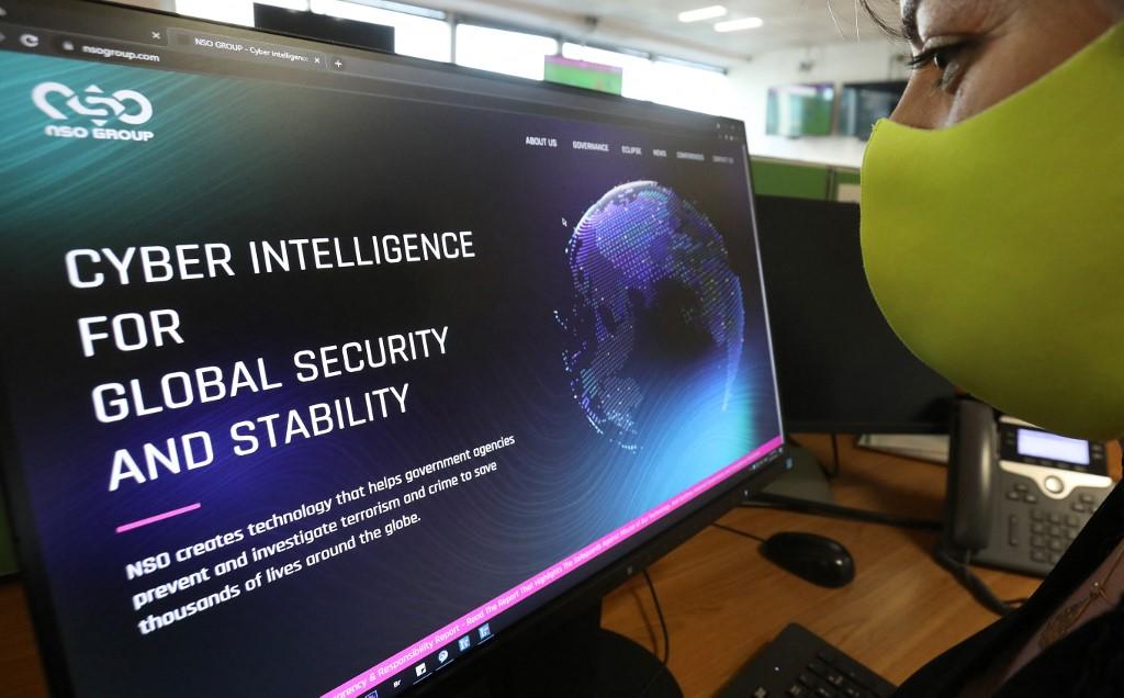 A woman checks the website of Israel-made Pegasus spyware at an office in the Cypriot capital Nicosia on July 21, 2021. Photo: AFP