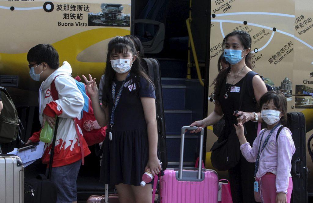 Travellers from Singapore arrive at the Larkin bus station in Johor Bahru as the border reopened under the Malaysia-Singapore Vaccinated Travel Lane last year. Photo: Bernama