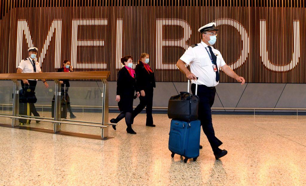 Qantas flight crew arrive at Melbourne's Tullamarine Airport on Nov 29, 2021. Photo: AFP