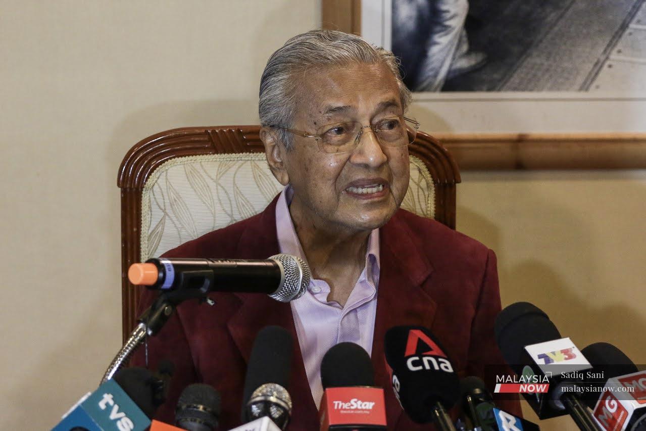 Former prime minister Dr Mahathir Mohamad speaks at a press conference in Putrajaya today.