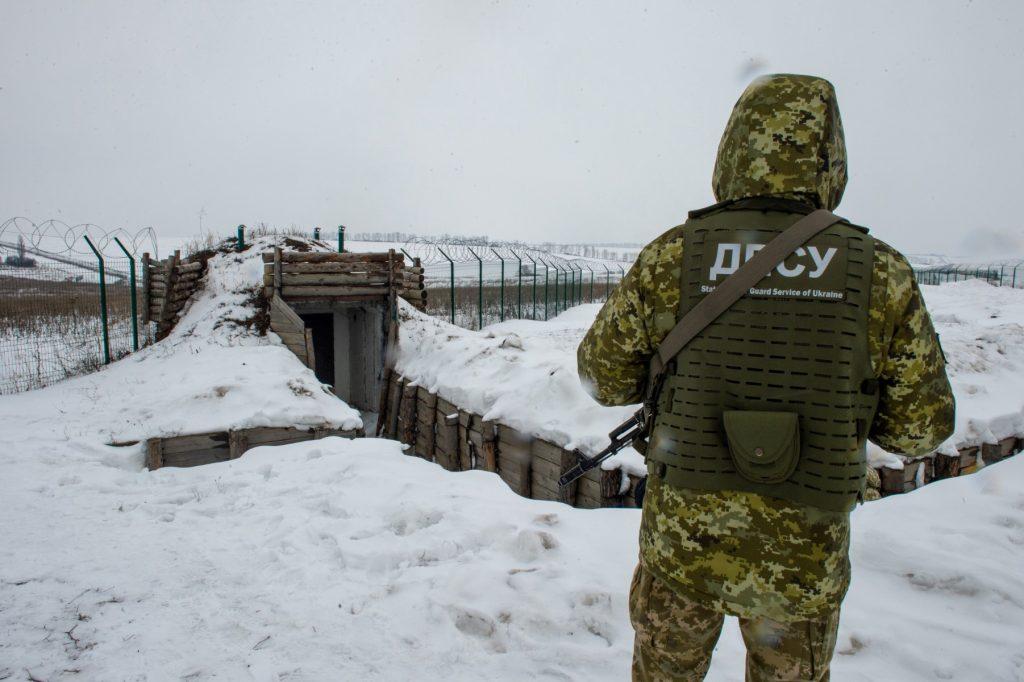 A Ukrainian soldier stands guard along the border with Russia, some 40km from the second largest Ukrainian city of Kharkiv, on Feb 7. Photo: AFP