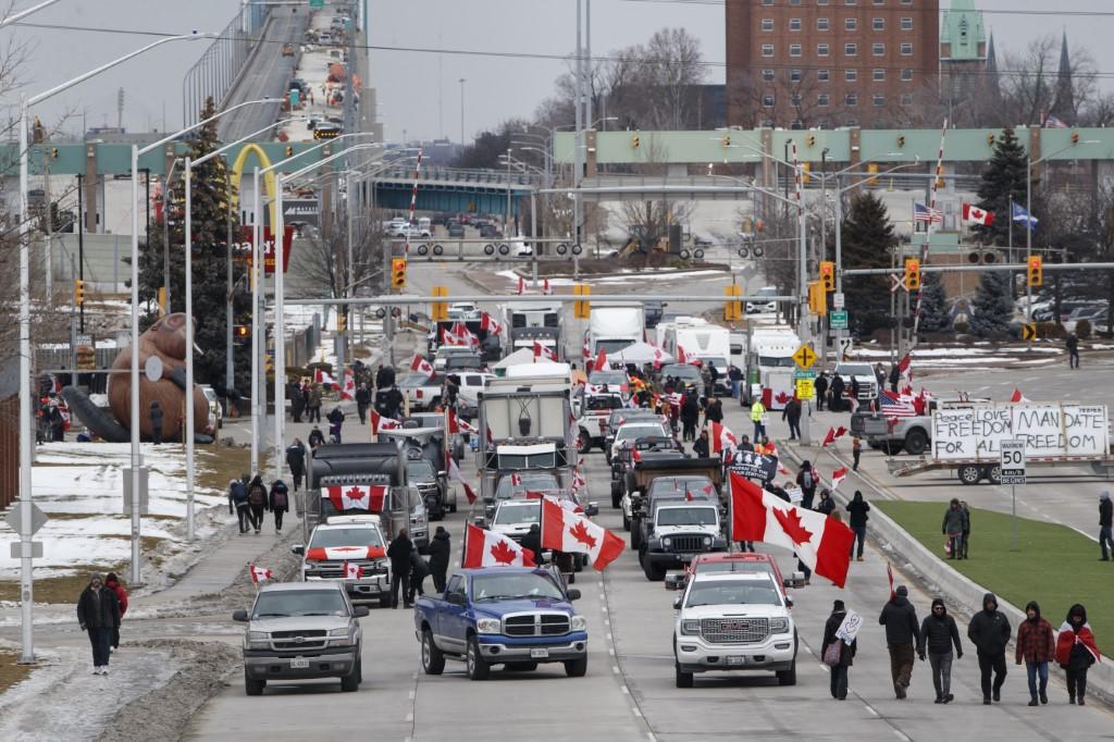 Protestors and supporters set up at a blockade at the foot of the Ambassador Bridge, sealing off the flow of commercial traffic over the bridge into Canada from Detroit, on Feb 10, in Windsor, Canada. Photo: AFP