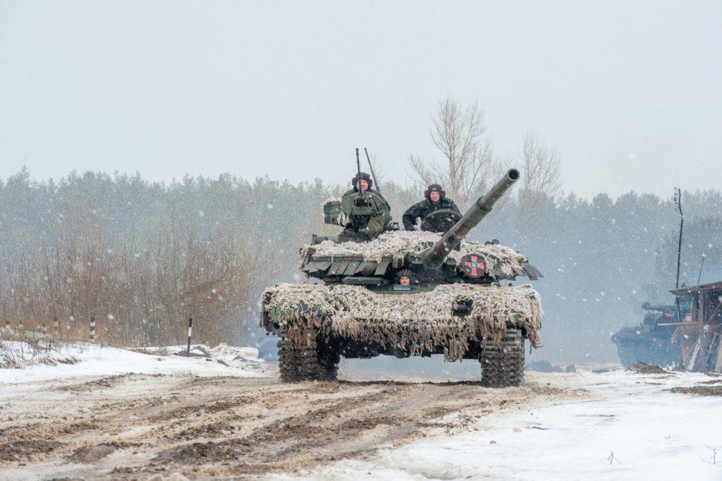 Ukrainian military forces servicemen of the 92nd mechanised brigade use tanks, self-propelled guns and other armored vehicles to conduct live-fire exercises near the town of Chuguev, in Kharkiv region, on Feb 10. Photo: AFP