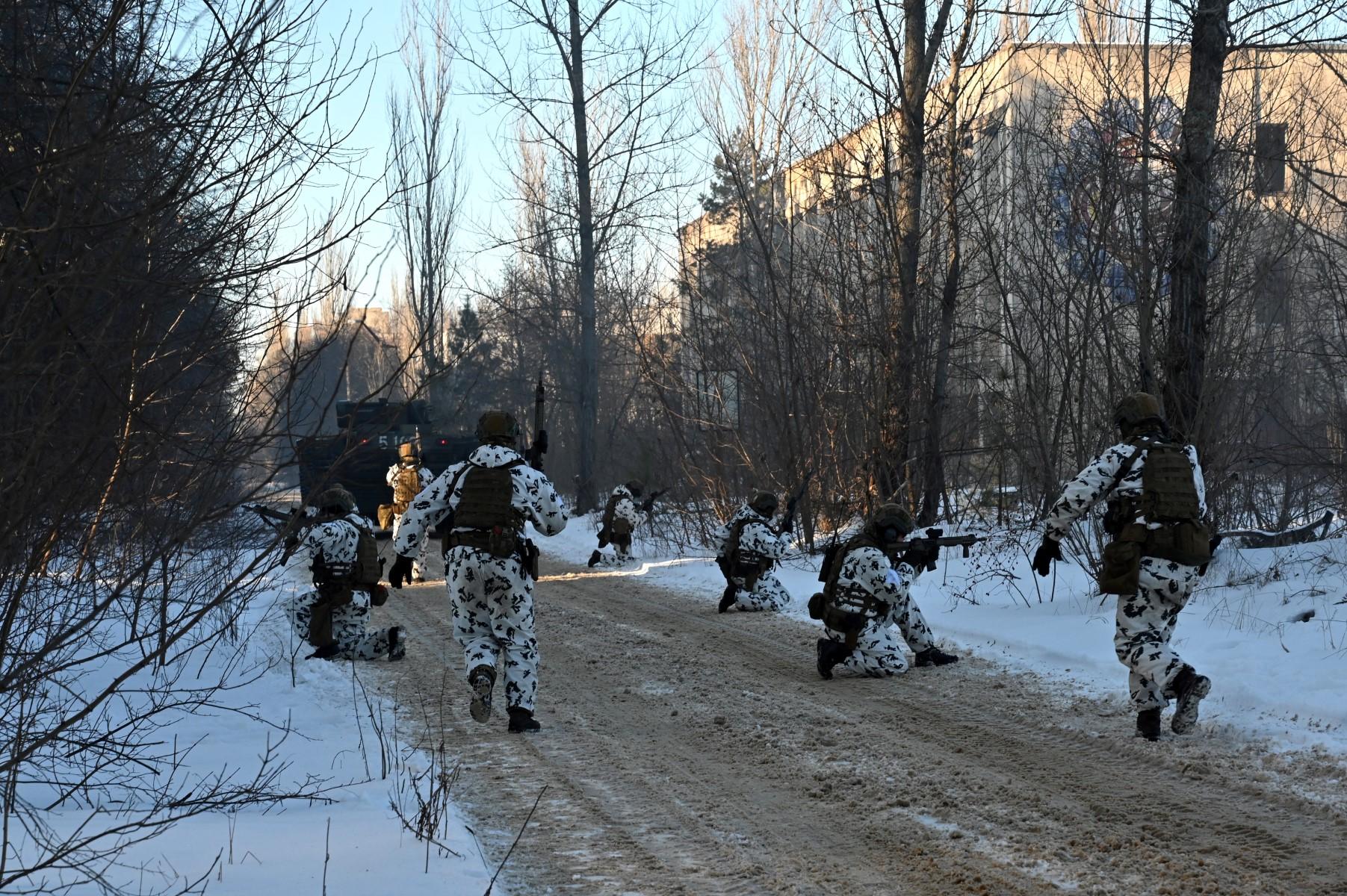 In this file photo taken on Feb 04, Servicemen take part in a joint tactical and special exercises of the Ukrainian Ministry of Internal Affairs, the Ukrainian National Guard and Ministry Emergency in a ghost city of Pripyat, near Chernobyl Nuclear Power Plant. Photo: AFP