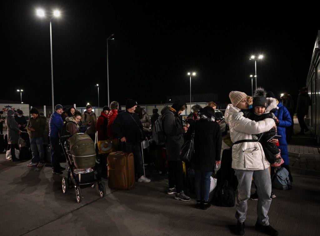 Ukrainians wait in line to enter Romania after crossing the Danube river at the Isaccea-Orlivka border crossing point between Romania and Ukraine on Feb 25. Photo: AFP