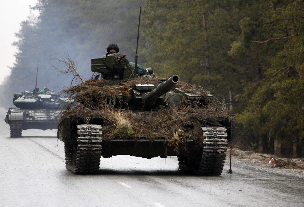 Ukrainian tanks move on a road before an attack in Lugansk region on Feb 26. Photo: AFP