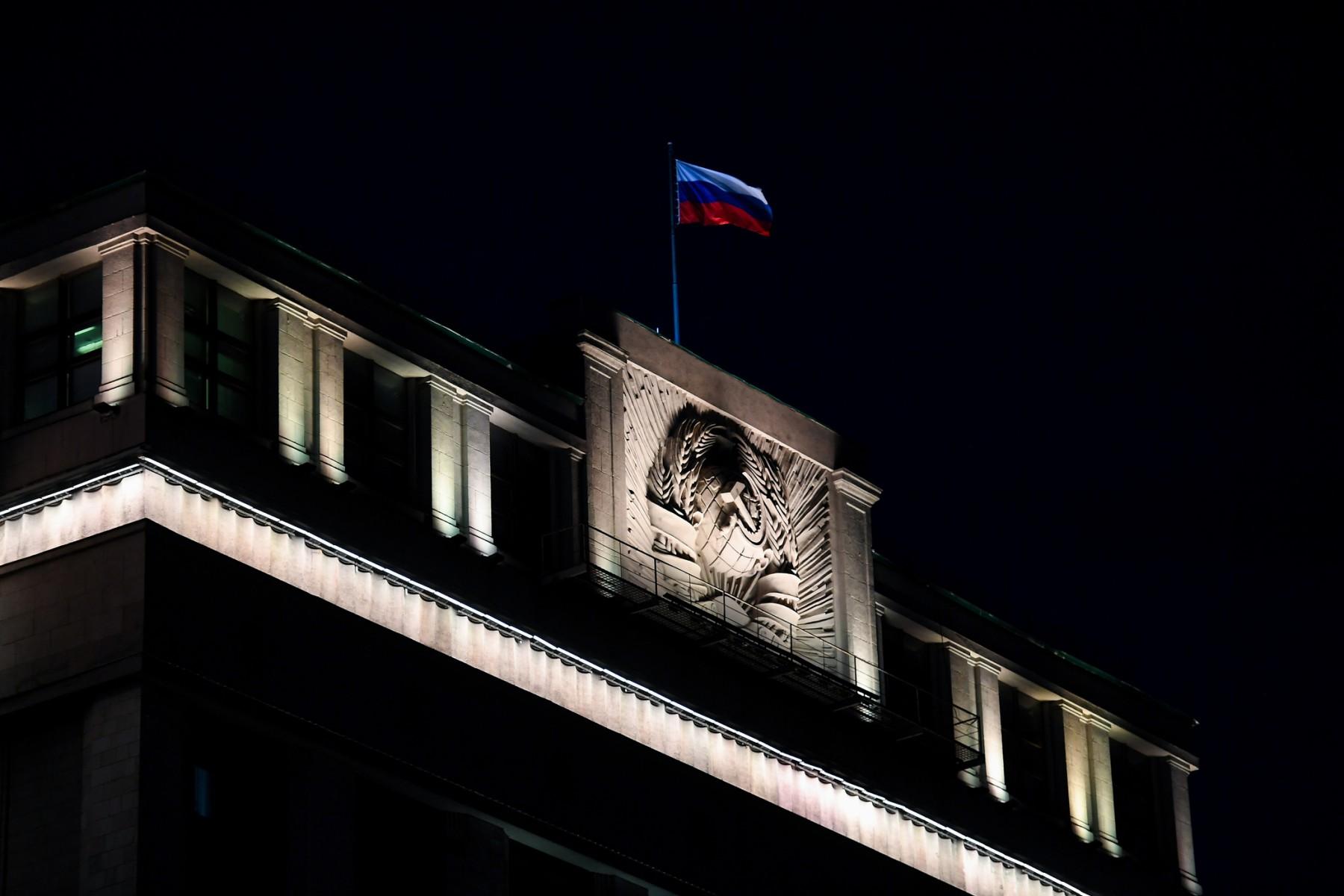 The Russian national tricolour flag flutters on top of the building of the State Duma, the lower chamber of Russia's parliament, in central Moscow in the evening of March 3. Photo: AFP