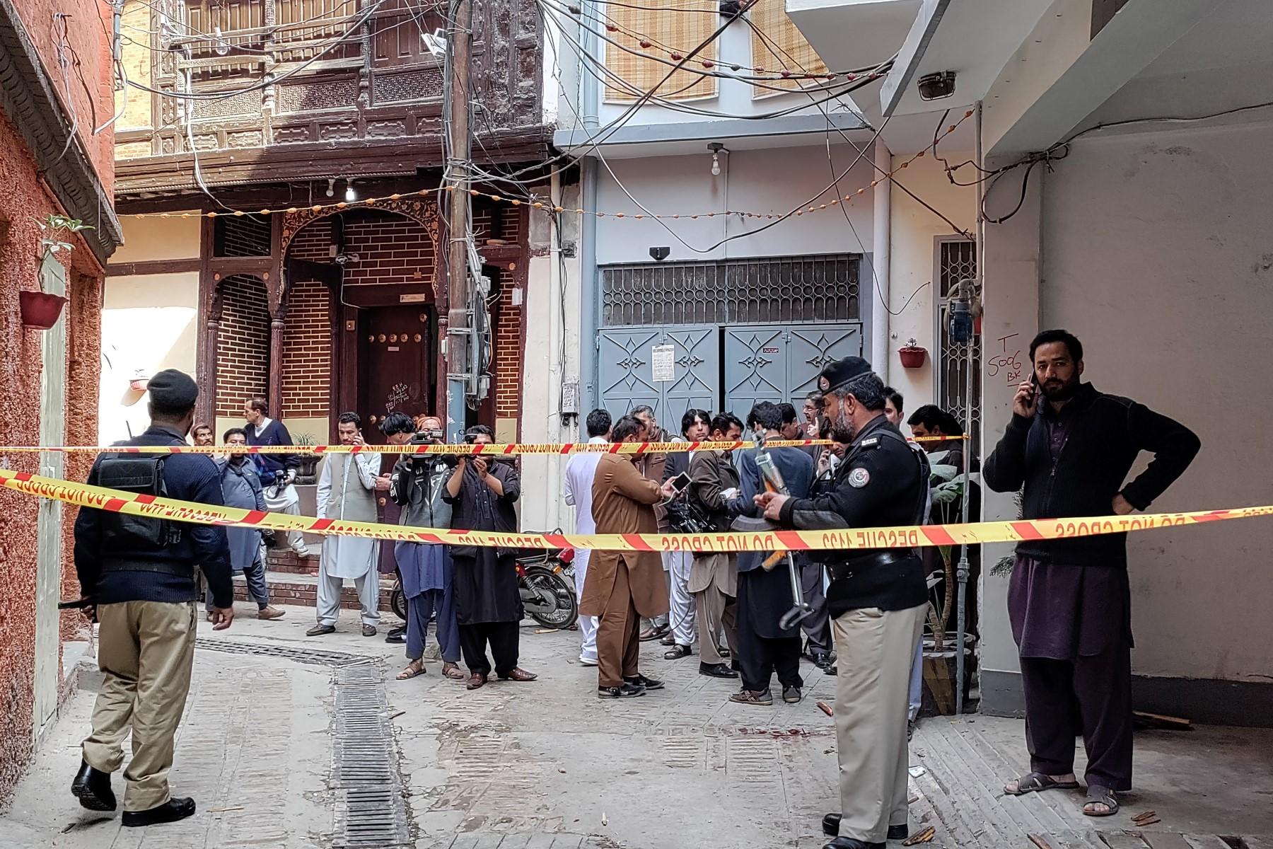 Policemen cordon off a street leading to a mosque after a bomb blast in Peshawar on March 4. At least 30 people were killed and 56 wounded in a huge blast at a mosque in the northwestern Pakistani city of Peshawar, a hospital official said on Friday. Photo: AFP