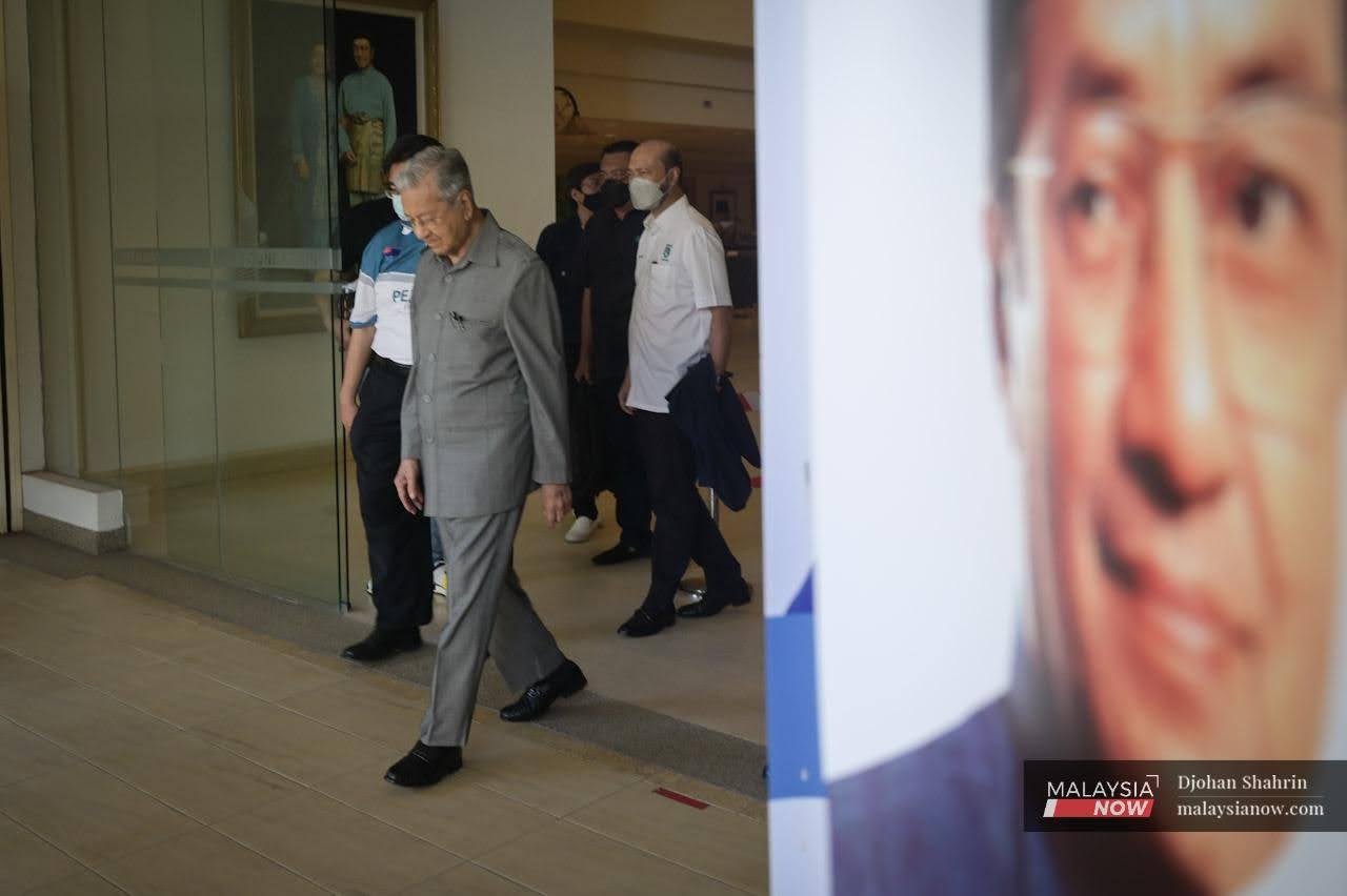 Pejuang chairman Dr Mahathir Mohamad leaves after holding a press conference at the Perdana Leadership Foundation in Putrajaya today.