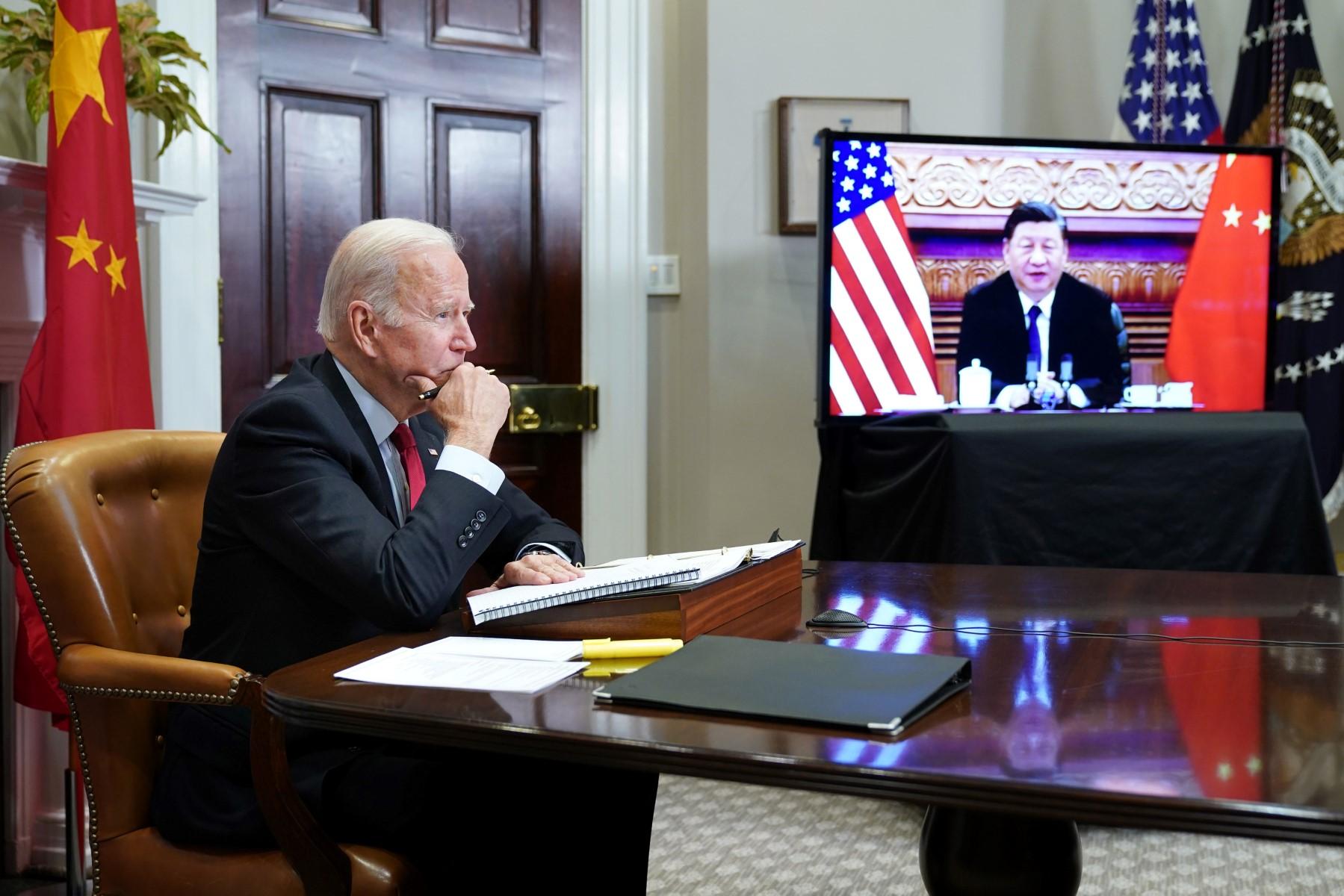 In this file photo taken on Nov 15, 2021, US President Joe Biden meets with China's President Xi Jinping during a virtual summit from the Roosevelt Room of the White House in Washington DC. Photo: AFP