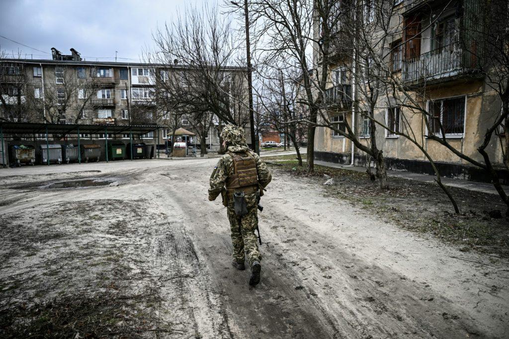 A Ukraine army soldier walks in the town of Schastia, near the eastern Ukraine city of Lugansk, on Feb 22. Some 400,000 people have been trapped in the strategic port city on the Sea of Azov for more than two weeks, with little if any access to water, food, heating or electricity, local authorities say. Photo: AFP