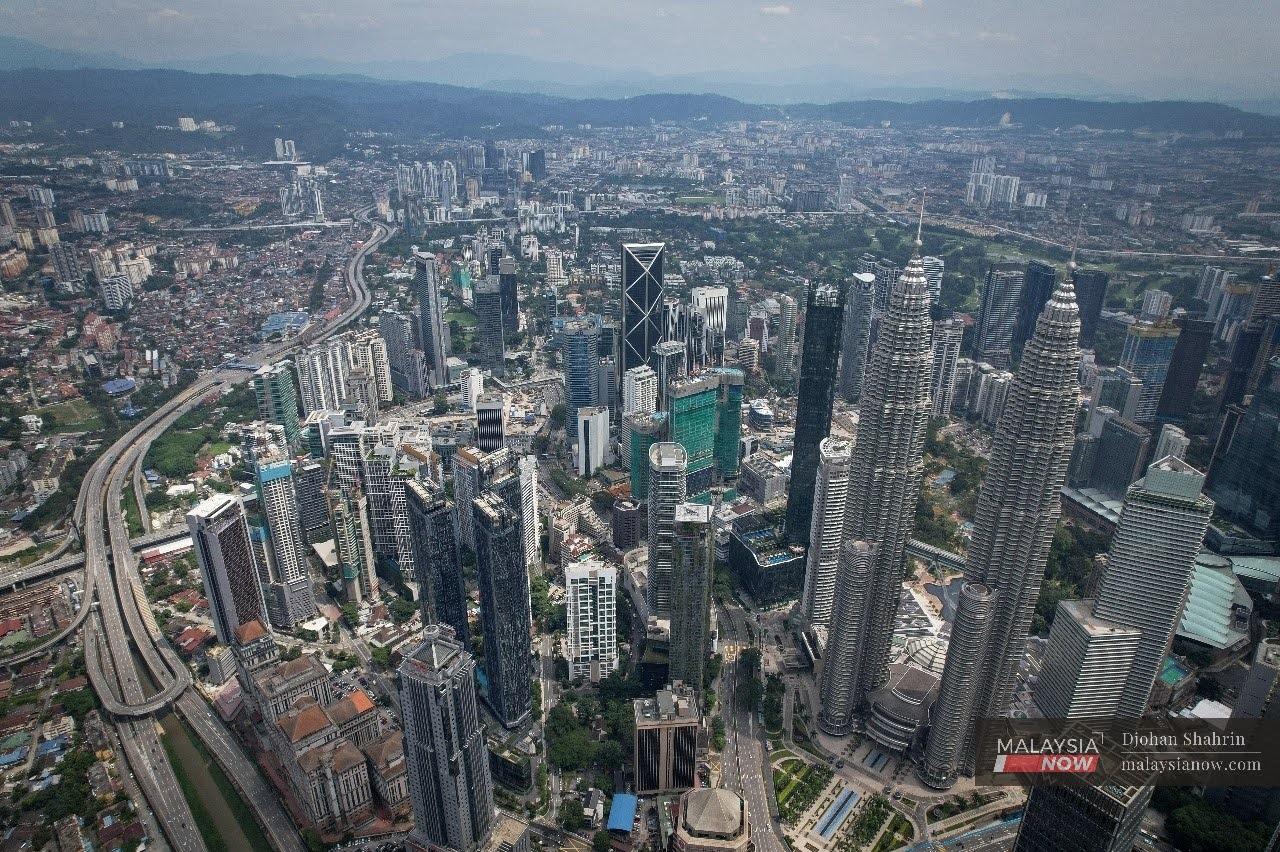 An aerial view of the Kuala Lumpur including the iconic Twin Towers in the heart of the city centre.