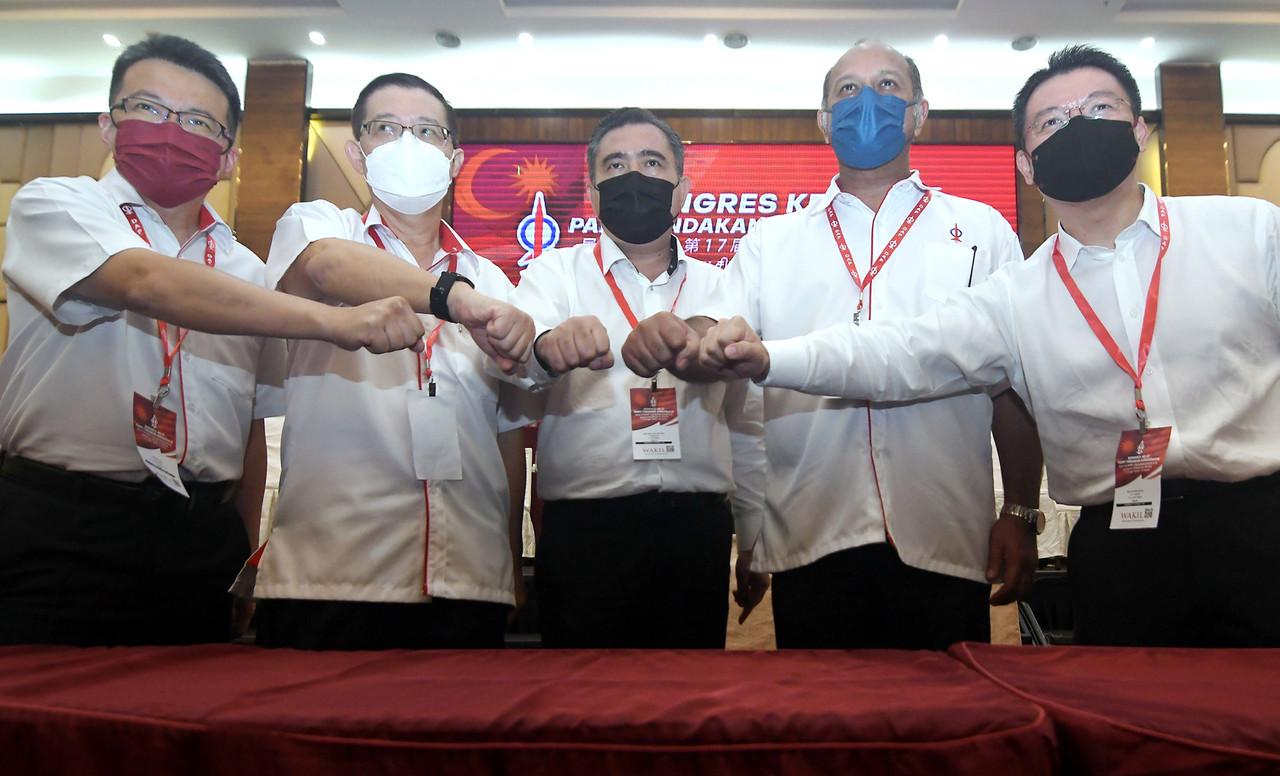 DAP's new secretary-general Loke Siew Fook (centre) with other party leaders including chairman Lim Guan Eng (second left) at its congress in Shah Alam on March 20. Photo: Bernama