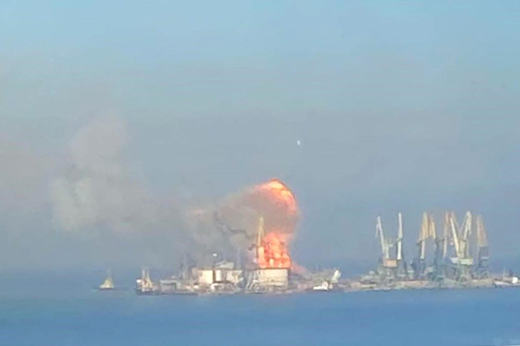 A handout picture released by the Ukrainian Navy on March 24, shows plumes of smoke and flames in the port of Berdyansk in the Azov Sea, 80km to the west of Mariupol, on the site where reportedly the large landing ship 'Orsk' of the Russian Black Sea Fleet is docked. Photo: AFP