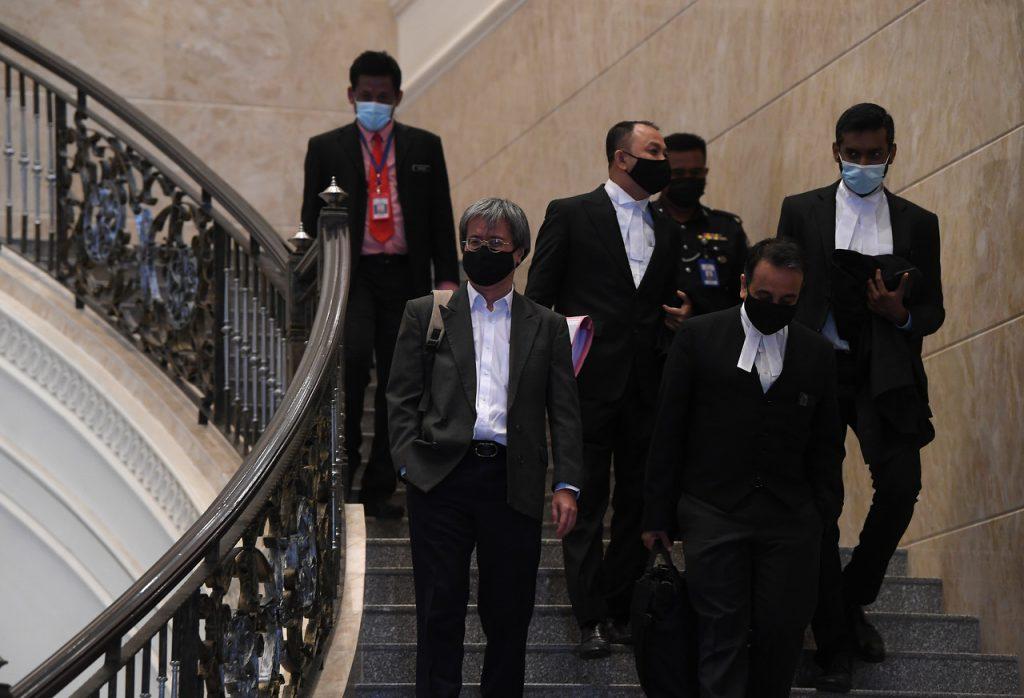 Malaysiakini editor-in-chief Steven Gan with his lawyers at the Palace of Justice last year. Photo: Bernama