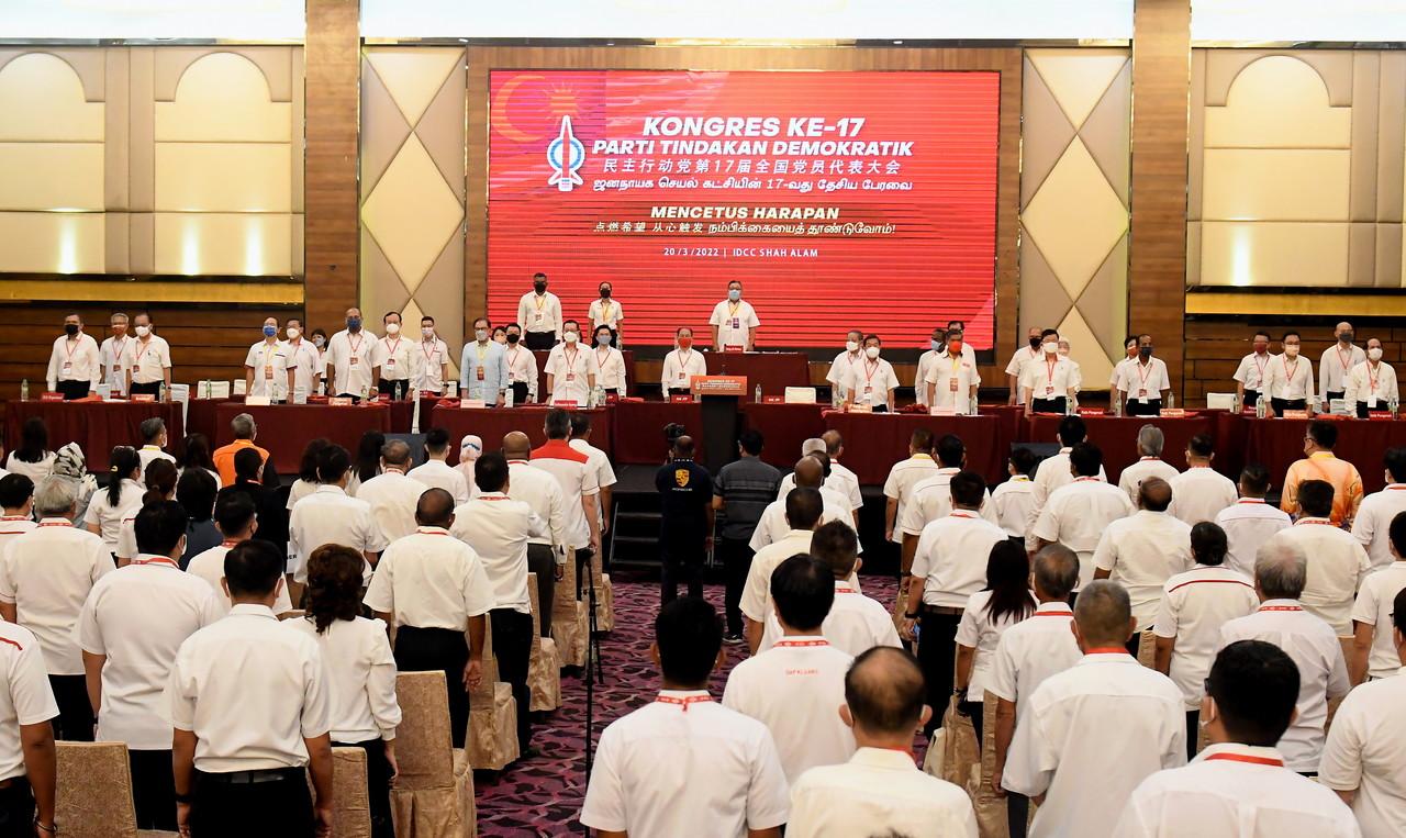 Party leaders and delegates stand at DAP's 17th national congress in Shah Alam on March 20. Photo: Bernama