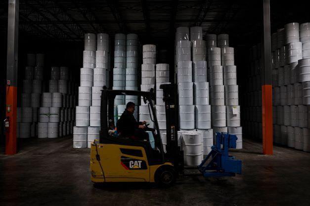 In this file photo taken on Dec 09, 2021 an employee drives a lift truck by barrels of pasteurised maple syrup from one of two maple syrup reserves at the Quebec Maple Syrup Producers storage facility in in Laurierville, Quebec, Canada. Photo: AFP