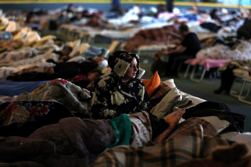 A Ukrainian woman who fled the war in her country takes refuge in the main hall of an athletic complex in the Moldovan capital Chisinau (Kishinev), on March 10. Photo: AFP