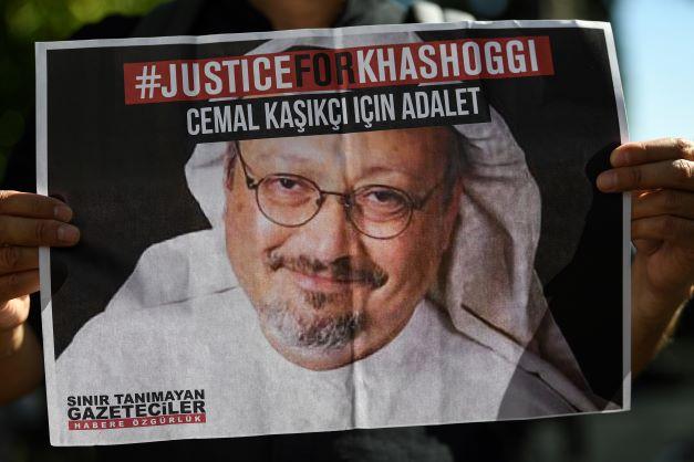 In this file photo taken on Oct 2, 2020, friends of murdered Saudi journalist Jamal Khashoggi hold posters bearing his picture as they attend an event marking the second-year anniversary of his assassination in front of Saudi Arabia Istanbul Consulate. Photo: AFP