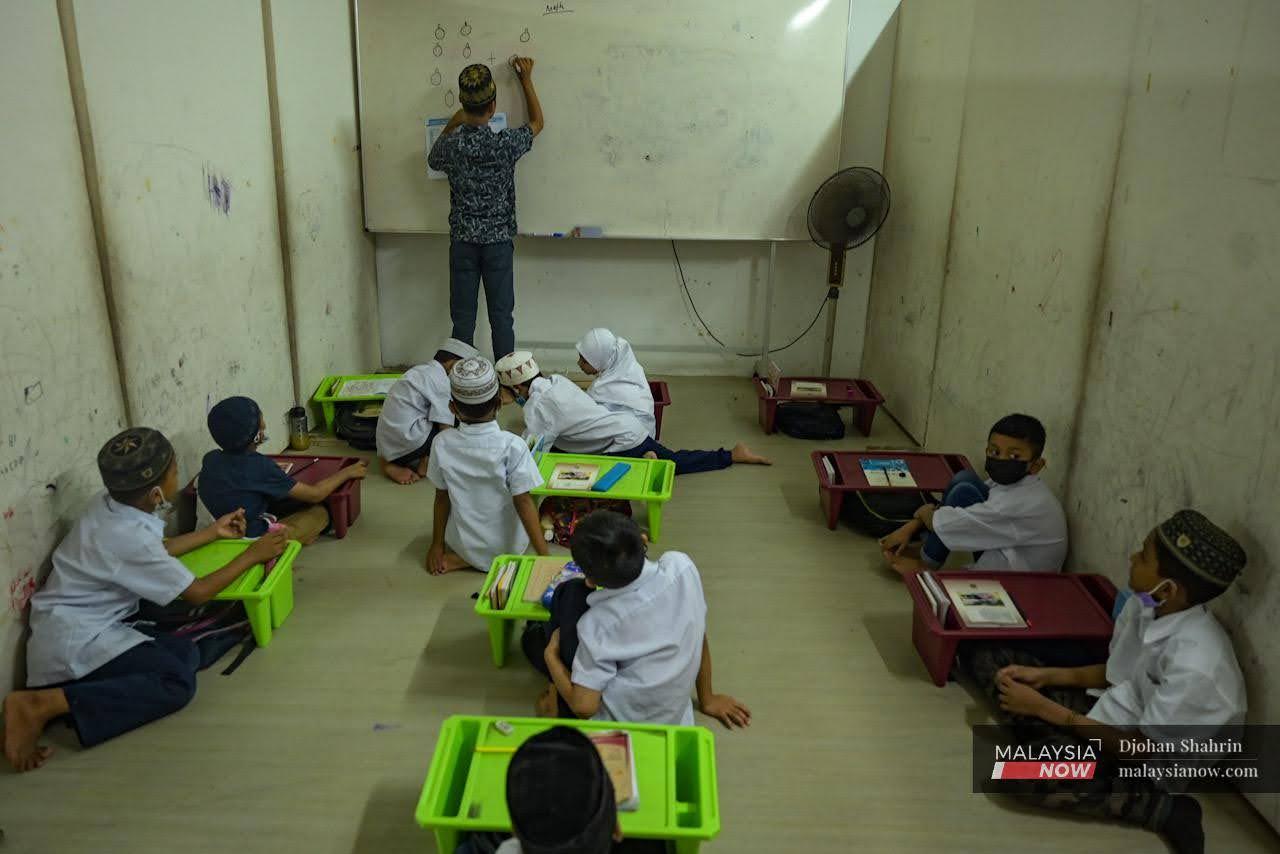 Rohingya children attend a mathematics class in a shabby classroom at the Darul Eslah Rohingya Academy in Ampang, Selangor.
