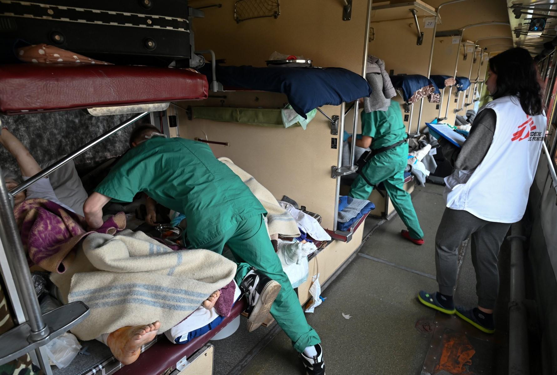 A Doctors Without Borders team care for patients on a medical evacuation train on its way to the western Ukrainian city of Lviv on April 10. Photo: AFP