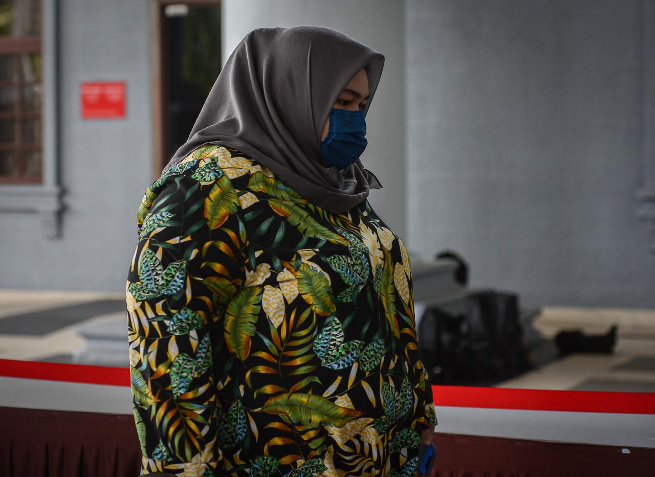 Rumah Bonda founder Siti Bainun Ahd Razali arrives at the Kuala Lumpur court complex yesterday. Photo: Bernama
