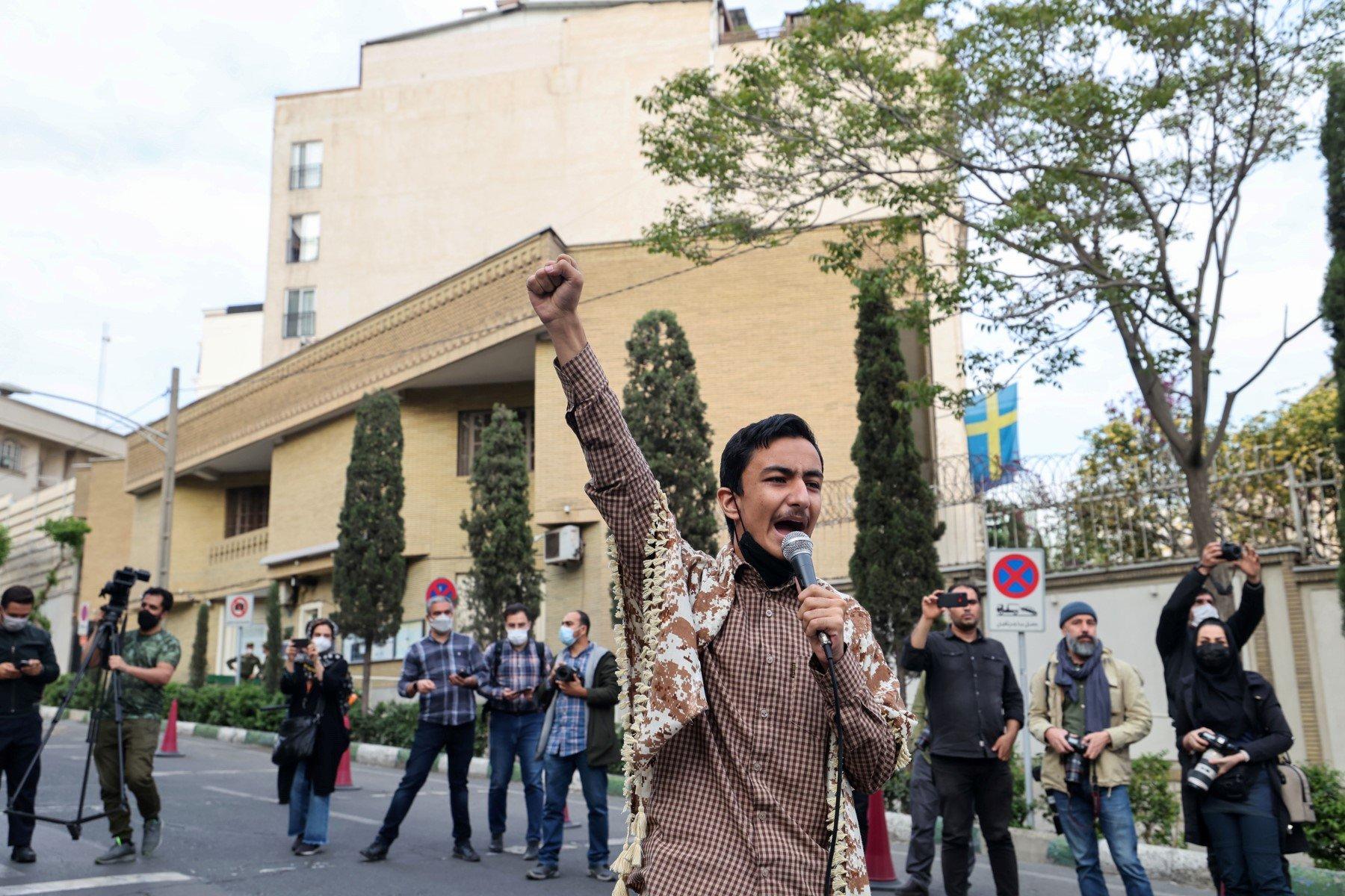 An Iranian student speaks during a rally in front of the embassy of Sweden in Tehran, on April 18, to protest a Swedish far-right group's plan to burn Qurans. Photo: AFP