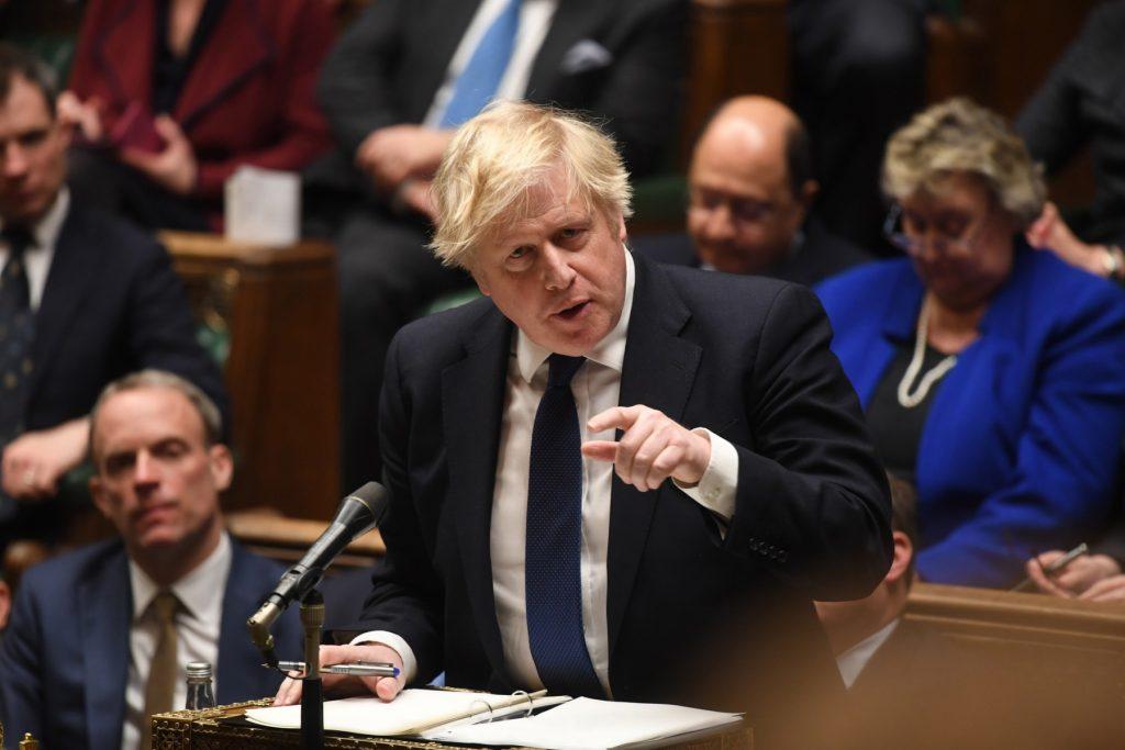 A handout photograph released by the UK Parliament shows Britain's Prime Minister Boris Johnson speaking to MPs on the situation in Ukraine following Russia's invasion in the early morning, in the House of Commons, in London, on Feb 24. Photo: AFP