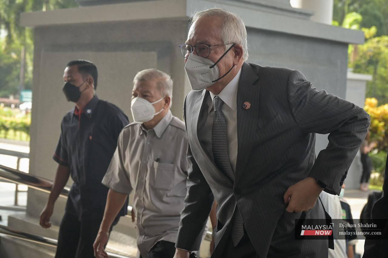 Former prime minister Najib Razak arrives at the Kuala Lumpur court complex for a 1MDB-related hearing.
