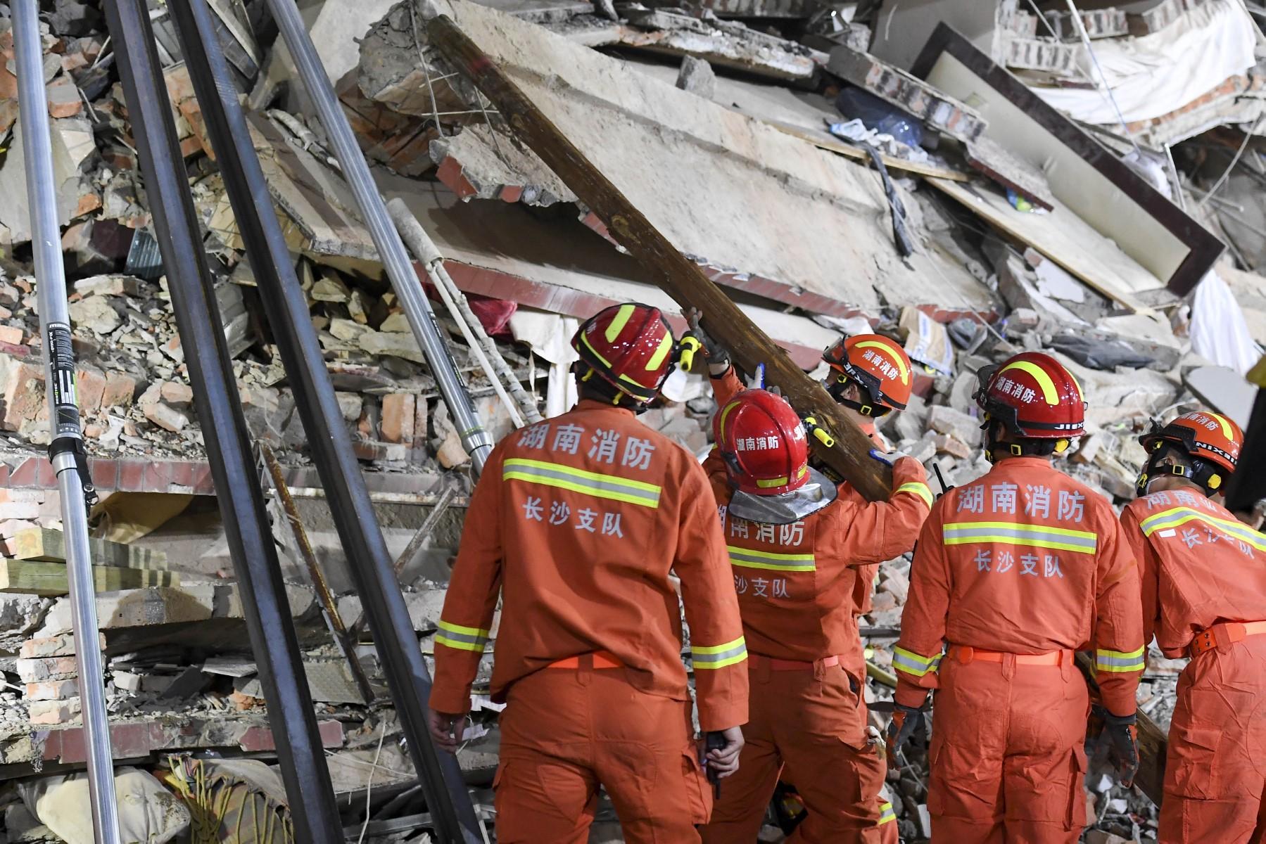 This photo taken on April 29 shows rescuers searching for survivors at a collapsed building in Changsha, central China’s Hunan province. Photo: AFP