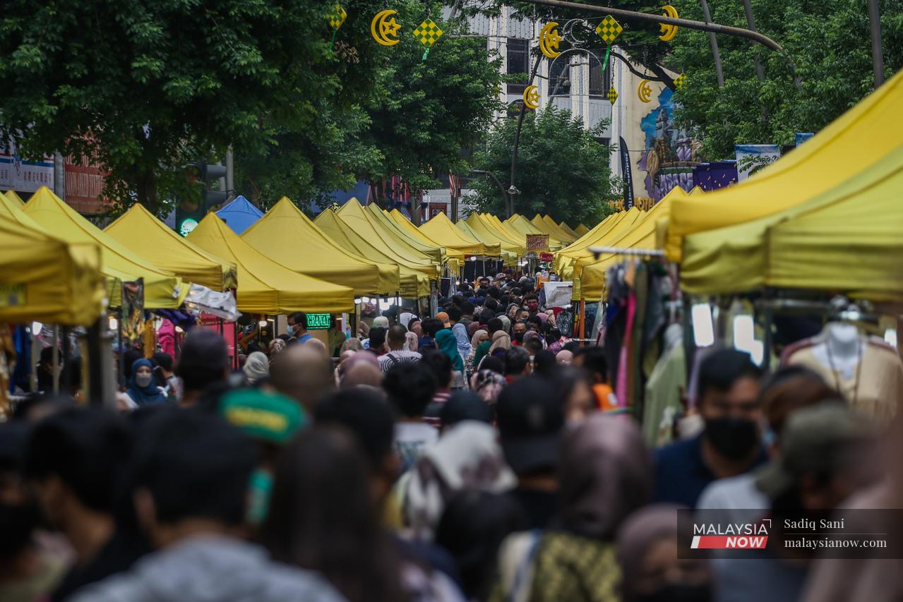 Crowds throng the bazaar at Jalan Tunku Abdul Rahman in Kuala Lumpur, one of many across the country which opened daily throughout the fasting month of Ramadan.