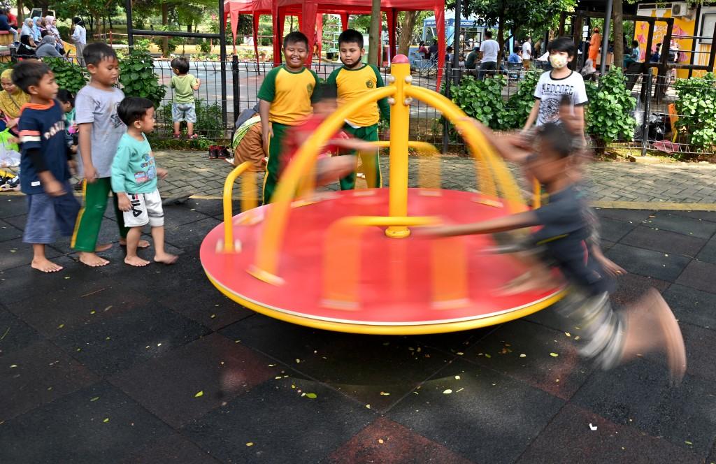Children play at a playground in Jakarta on March 29. Photo: AFP