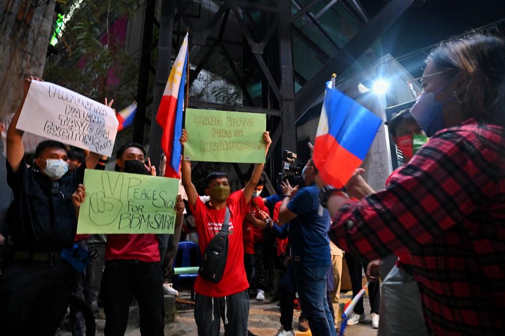 Supporters of the Philippines presidential candidate Ferdinand Marcos Jr celebrate a temporary result of votes outside Marcos headquarters in Manila on May 9. Photo: AFP