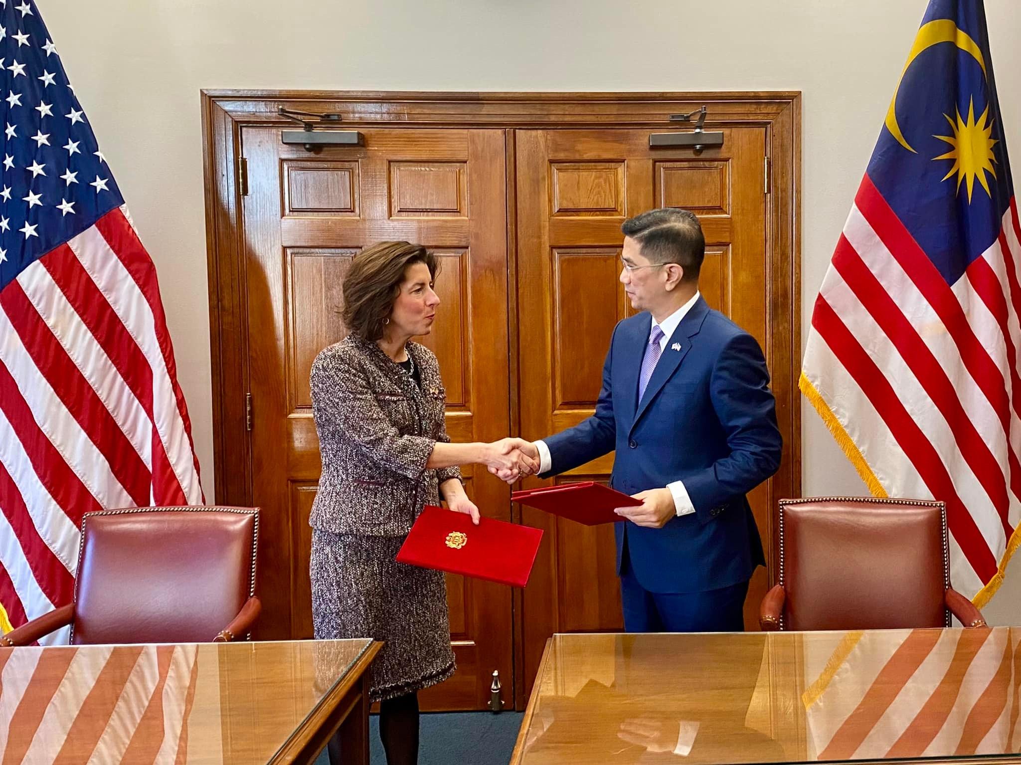 International Trade and Industry Minister Mohamed Azmin Ali with US Secretary of Commerce Gina Raimondo after signing a memorandum of cooperation to further strengthen the semiconductor supply chain resiliency. Photo: Facebook