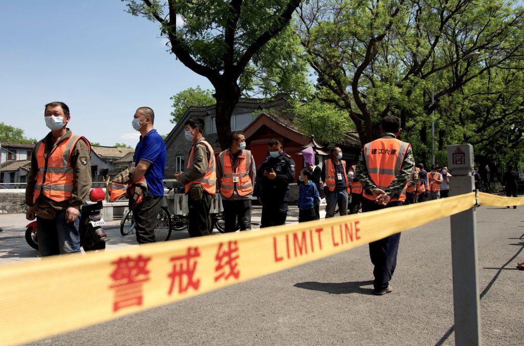People queue for a swab test for Covid-19 near the entrance of the Forbidden City in Beijing on May 1. Photo: AFP