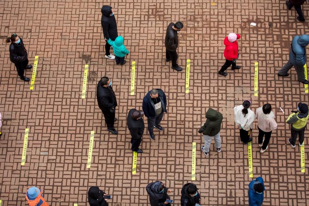 Residents queue to undergo nucleic acid tests for Covid-19 in Jilin in China's northeastern Jilin province on March 12. Photo: AFP
