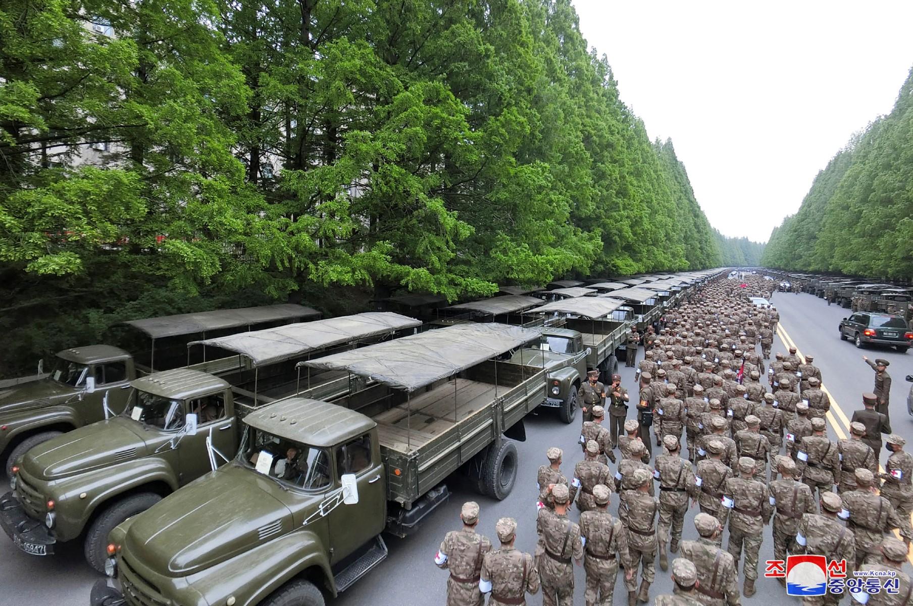 This picture taken on May 16, and released from North Korea's official Korean Central News Agency on May 17 shows officers of the military medical field of the Korean People's Army going to supply medicines to resolve the epidemic prevention crisis over the spread of Covid-19, in Pyongyang. Photo: AFP