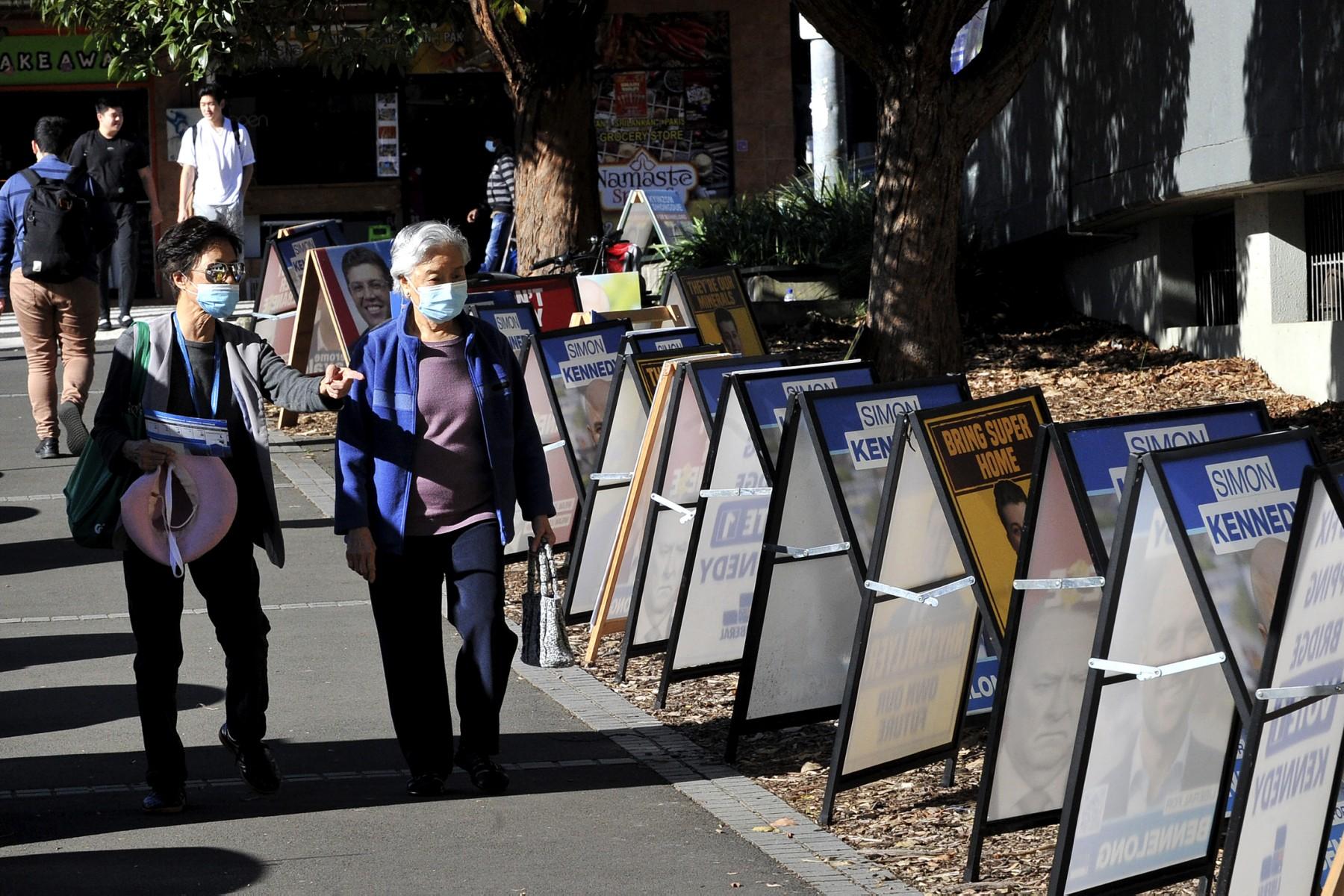 This picture taken on May 17 shows residents walking to cast their votes at a pre-polling station in Epping suburb of Sydney, as Australians go to the polls on May 21 to decide who will run the country for the next three years. Photo: AFP