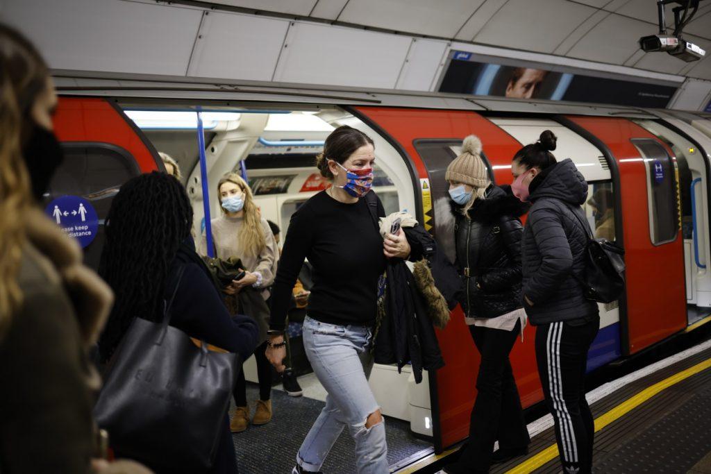 Passengers exit a London Underground tube train during the morning rush hour in London on Dec 2, 2020. Photo: AFP