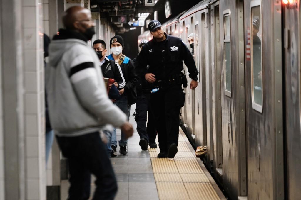 Police search for a suspect in a Times Square subway station following a call to police from riders on April 25, in New York City. New York City has seen a sharp rise in violence and a series of random attacks on subway riders. Photo: AFP