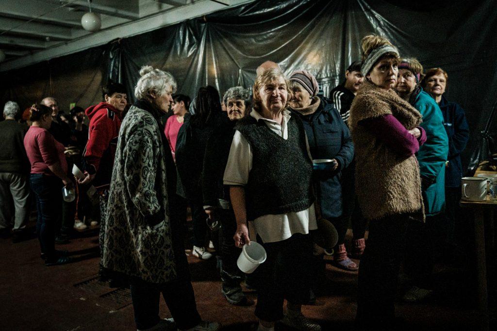 Internally displaced people wait for food distribution in a bunker at a factory in Severodonetsk, eastern Ukraine, on April 22, amid the Russian invasion. Photo: AFP