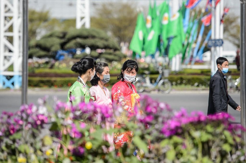 Pedestrians walk along a street in Pyongyang on April 14. North Korea has been under a rigid coronavirus blockade since the start of the pandemic in 2020. Photo: AFP
