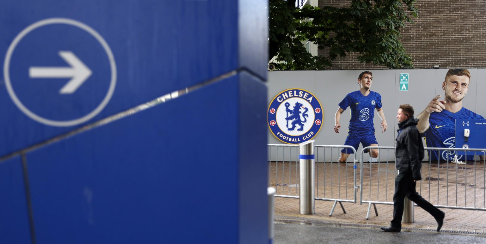 A pedestrian walks outside Stamford Bridge, home ground of Chelsea football club, in London on May 24. Photo: AFP