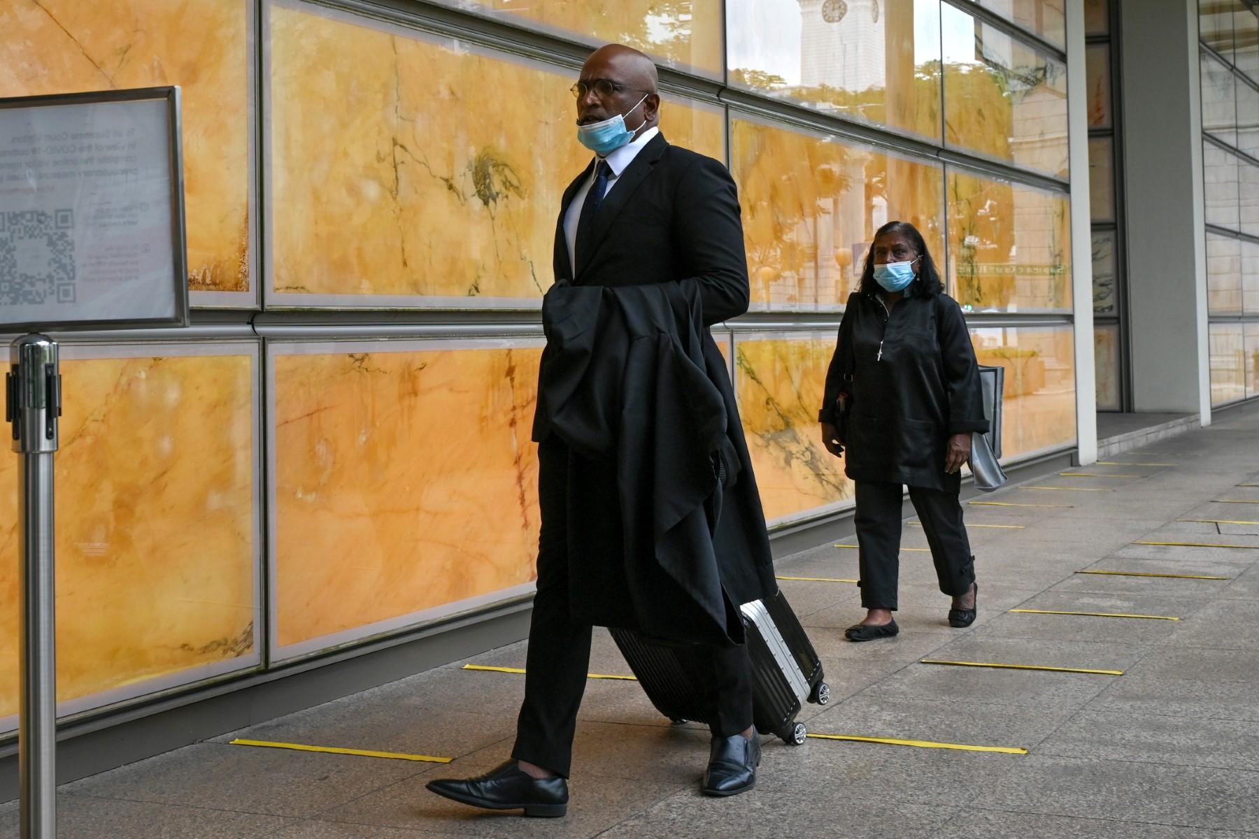 Singapore lawyers M Ravi (front) and Violet Netto (back) arrive at the Supreme Court in Singapore on March 1, for the hearing of Nagaenthran K Dharmalingam's appeal against his death sentence. Photo: AFP