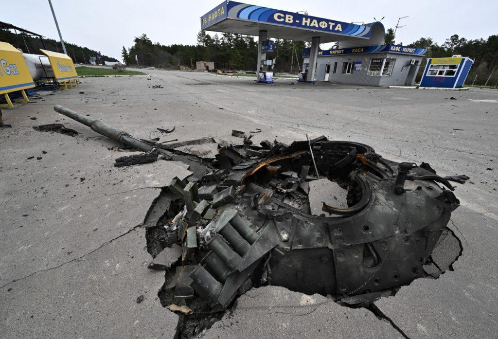This photo shows the debris of a destroyed Russian tank at a damaged petrol station near the village of Zalissya, northeast of Kyiv, on April 12. Photo: AFP