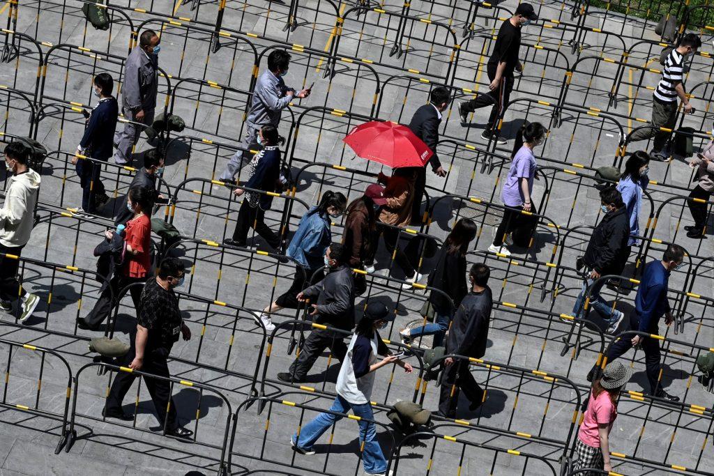People line up in Zhongguancun in Beijing on April 26. Photo: AFP