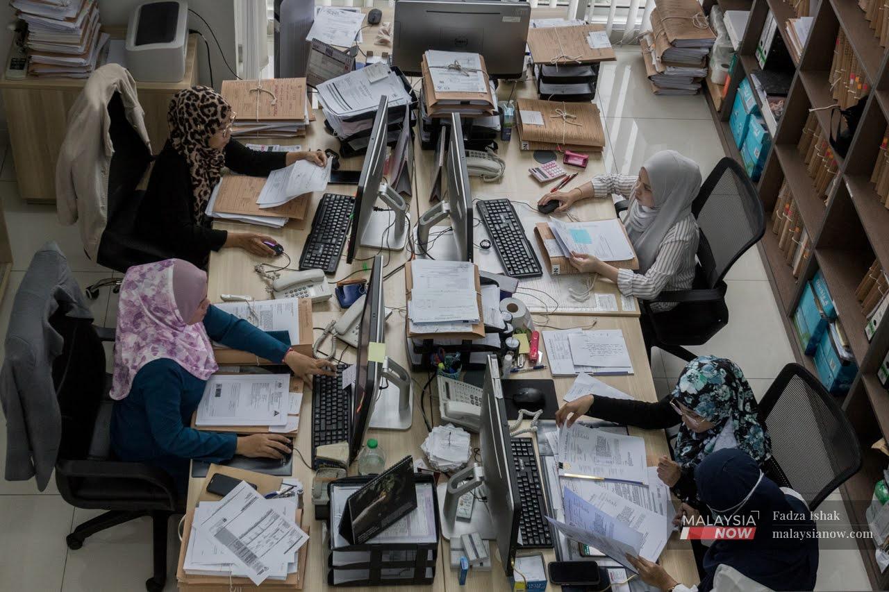 Office workers hard at work at a company in Shah Alam. Jobseeking appears to have taken a new twist, with some applicants sharing stories of personal difficulties instead of their resumes.
