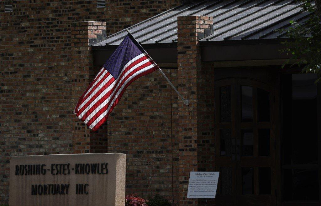 A US flag flies at Rushing-Estes-Knowles Mortuary during the funeral of one of the victims of the mass shooting at Robb Elementary School, on June 2 in Uvalde, Texas, where 19 students and two teachers were killed on May 24. The US has been rocked by a series of high-profile mass shootings in recent weeks. Photo: AFP