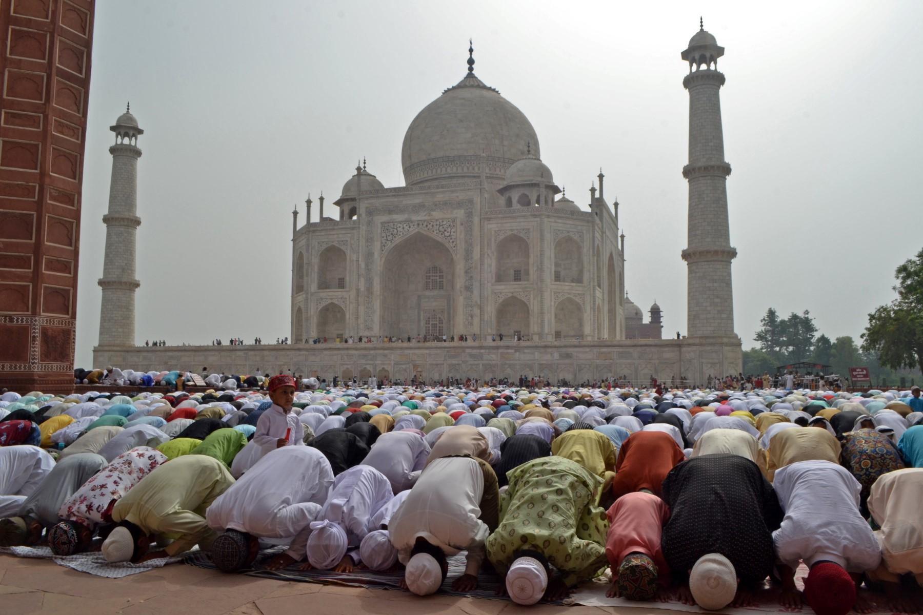 Muslim devotees offer a special morning prayer to start the Eid festival, which marks the end of their holy fasting month of Ramadan, inside the complex of Taj Mahal in Agra on May 3. Photo: AFP