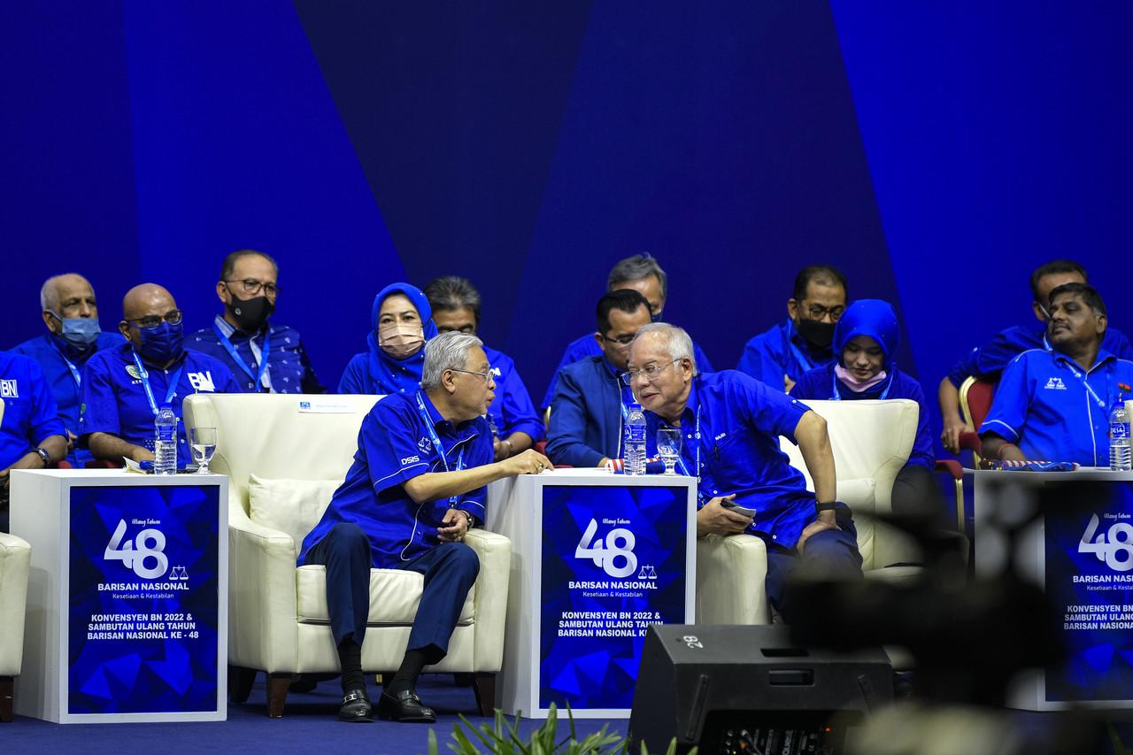 Prime Minister Ismail Sabri Yaakob speaks with former leader Najib Razak during the Barisan Nasional convention at the World Trade Centre in Kuala Lumpur on June 1. Photo: Bernama